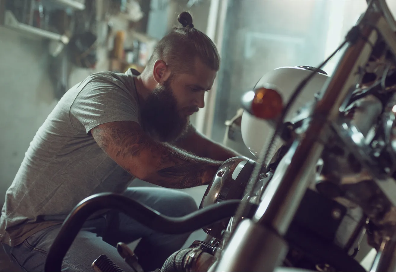 Mechanic Fixing Motorcycle